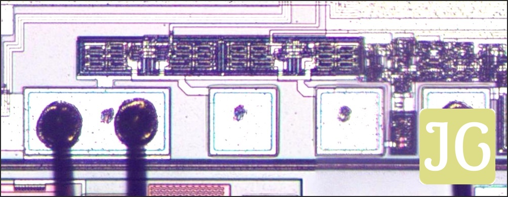 A close-up of the die showing three bond pads with bond wires and two bond pads without bond wires.