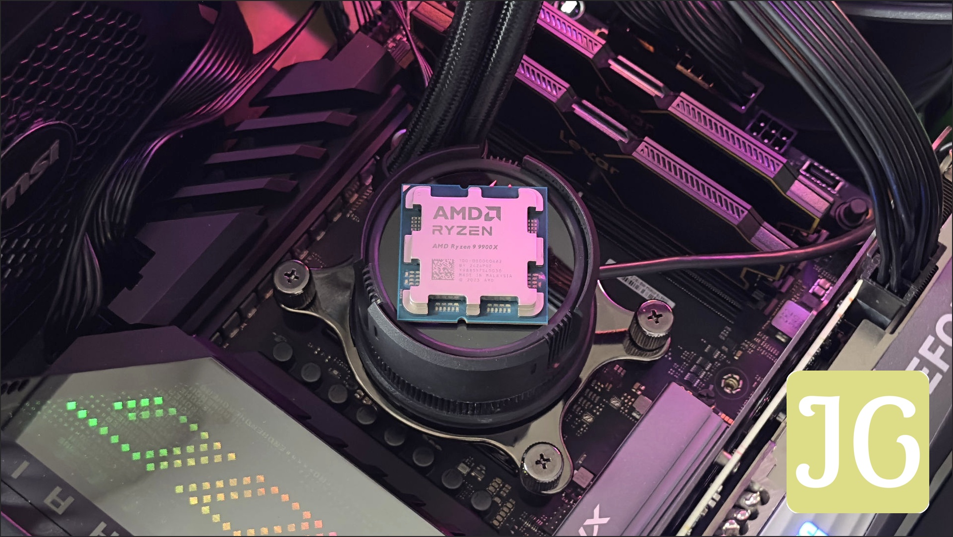 A photo of an AMD Ryzen processor resting on a CPU cooling unit in a motherboard