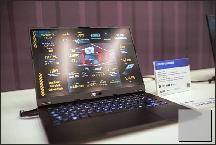 The Asus TUF A14 on a table at a press event.