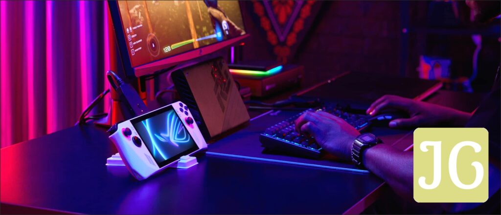 Person sitting at a desk with a keyboard, mouse, and external monitor, and with their Ally connected to the system and an XG Mobile, playing a competitive game.